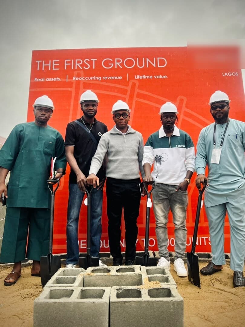 The groundbreaking team in hard hats with shovels on the Falcon site